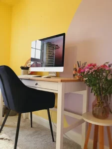 yellow office with desk and computer