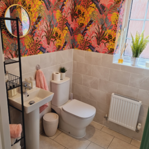Bathroom with bright wallpaper